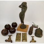 A figure of a scantily clad woman, lawn bowls and other items