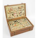 Aprox. 550 trout flies in a three compartment box