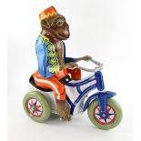 Toys (1992) An oversized vintage Monkey riding a tricycle clockwork tinplate toy used in the Zevo