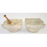 Two white marble mortars and a pestle