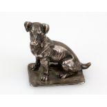Sterling silver paperweight in the form of a dog, realistically modelled seated wearing a collar, on