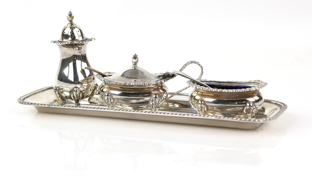 Modern silver cruet set, comprising salt, mustard, pepperette and tray, with gadrooned borders, with