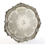 Victorian silver salver with moulded scroll and bead border and engraved decoration, on three ball