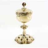 George V silver gilt ciborium, with knopped stem on lobed base set with garnets, by Frederick