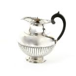 Victorian silver hotwater jug with shell and scroll moulded rim and half gadrooned body, by Mappin