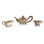 George VI silver three piece tea service, comprising teapot, cream jug and sugar bowl, with