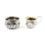 Victorian silver cream jug and sugar bowl, with embossed and gadrooned decoration, by Josiah