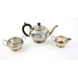 George V silver three piece tea service, comprising, tea pot, cream jug and sugar bowl of plain form