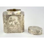 German silver tea-caddy and cover, the capped octagonal body chased with figures in a landscape,
