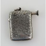 Victorian silver combination vesta case/cigar cutter, chased with leaves and monogram, by Robert