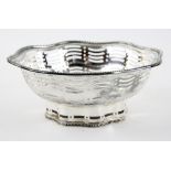 George V silver bowl, the shaped pierced sides with beaded rim, on conforming foot, by Atkin