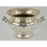 Edward VII silver twin-handled bowl, with flared rim and on footed base, the planished body chased