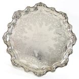 Victorian silver salver with moulded shell and engraved decoration on four scroll feet, by R & S