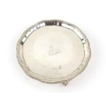 Victorian silver waiter with shaped and gadrooned rim on three ball and claw feet, by Goldsmiths &
