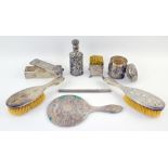 Indian silver and white metal dressing table items to include a scent bottle, two dressing table