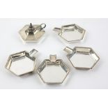 George V silver table lighter with four stacking ash trays, each hexagonal, by Hukin and Heath,