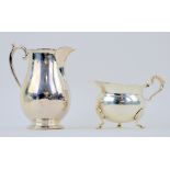 George V silver cream jug of baluster form on round foot, by Goldsmiths & Silversmiths Co. Ltd.,