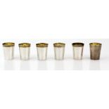 Set of six sterling silver tot cups, with planished finish and gilt interiors, 5.5 cm high, 304