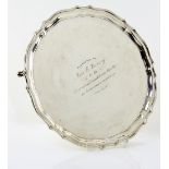 George VI silver salver with serpentine border on three shaped feet, by Cooper Brothers & Sons Ltd.,