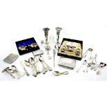 Selection of silver items to include two cased cruets, a pair of bud vases, one with blue glass