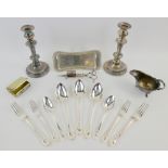 Small group of silver plated items including a pair of candlesticks, selection of flatware, sauce