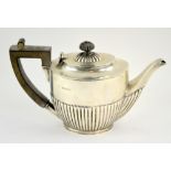 Victorian bachelor's silver teapot, with fluted lower body and ebonised handle and finial, 12 cm
