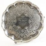 Victorian silver salver of lobed form with engraved decoration on three scroll feet, by Edward and