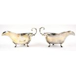 George V pair of silver sauce-boats, of plain form with loop handles and three shell-capped hoof