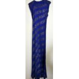 Late 1930's evening dress of midnight blue crepe with silvered thread, gathering to shoulders,