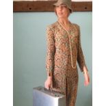 Silk floral print day dress, with full sleeve and V neck, and a pewter coloured straw cloche hat ,
