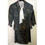 1940's two piece suit with abstact floral print, charcoal grey needle cord, peplum back, labelled 38