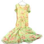 1930's evening dress of floral printed green chiffon, short bell sleeves, peach silk lining