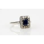 Sapphire & diamond cluster ring, rectangular step cut sapphire, round brilliant cut diamond