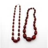 1930's graduated Bakelite necklace, largest oval bead 2.6 x 1.7cm, strung with knots, measuring 41