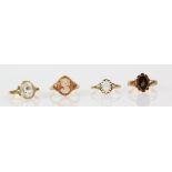 A group of rings, one set with oval cut rock quartz crystal, mount stamped 18 ct, ring size M,