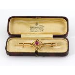 Edwardian diamond and synthetic ruby bar brooch, measuring approximately 5.5 x 2cm, mount stamped 15