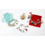 Mixed group of items, three silver charm bracelets, each with several charms, including steam