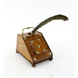 An unusual stationary cabinet inkwell in the form of a purdonium, the lifting lid revealing