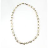 Brett Payne necklace, textured 18 ct gold bead detail and silver loop, measuring approximately