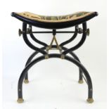 Aesthetic Movement, painted metal and brass X-framed adjustable music stool with ebonised dished