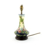 Moorcroft ' Sweet Briar' pattern lamp base, with decoration of a briar rose on yellow to blue