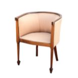 An Art Deco tub chair, mahogany with satinwood banding, on turned legs on square section tapering