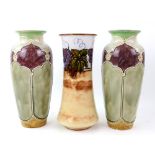 Three Doulton stoneware vases, a pair with Moorish design, incised marks for Florrie Jones, height