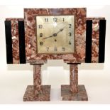 French Art Deco rouge marble three-piece clock garniture, the centre time piece of stepped