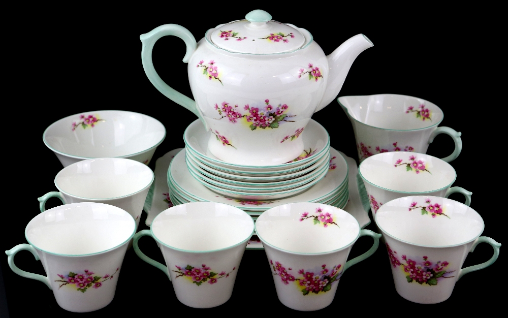 Shelly tea service, in blossom pattern with green banding .