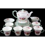 Shelly tea service, in blossom pattern with green banding .