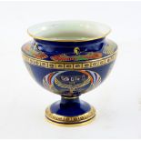 Calrton ware Tutankhamun pot on circular foot, decorated in enamels and gilt with chariot and