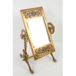 Aesthetic movement table mirror, the brass frame with pierced floral decoration, in stand with