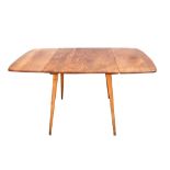 Ercol breakfast table, in elm and beech, with two drop down ends, max size, 137 x 74 cm . Some