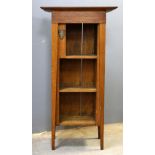 Arts and Crafts oak open bookcase, with front and side shelves, applied metal crest registered